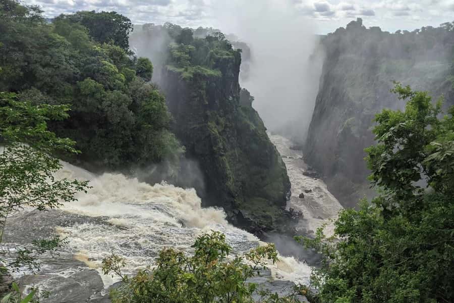 From Livingstone: Day Trip to Victoria Falls, Zimbabwe - Entering Victoria Falls National Park