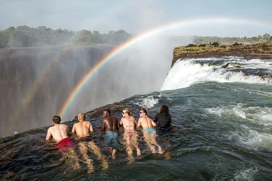 From Victoria Falls: Livingstone Island Tour & Devils Pool - The morning begins with a border crossing
