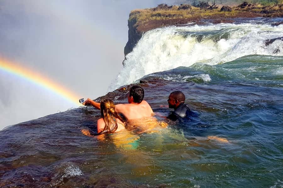From Victoria Falls: Livingstone Island Tour & Devils Pool - A five-minute boat ride across the Zambezi