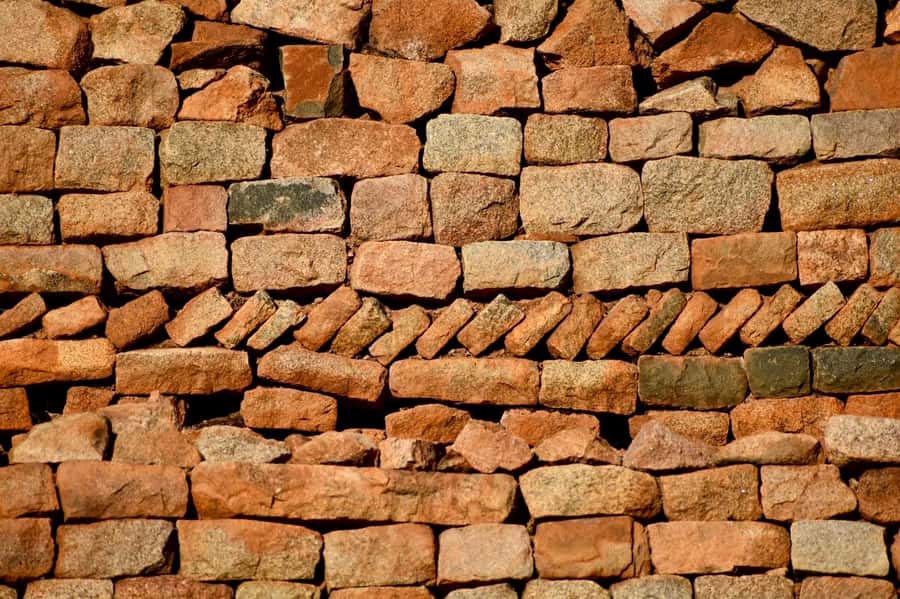 Khami Ruins: Guided Tour with Sunset Drinks - Reading the stone walls at the Kings Residence